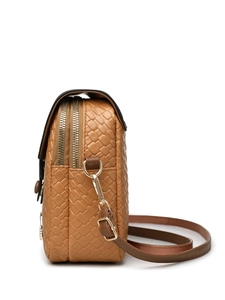 Detail of tan woven crossbody bag with dual golden zippers and adjustable fabric strap
