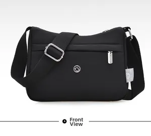 Close-up of waterproof nylon shoulder bag showing zipper pocket and branded logo detail