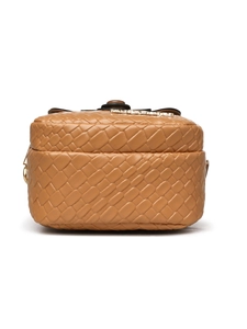 Detailed view of brown woven texture handbag with metallic logo and gold hardware