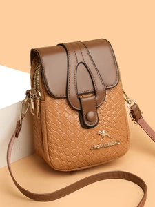 Close-up of woven texture and gold kangaroo logo on a dual-zip crossbody phone bag