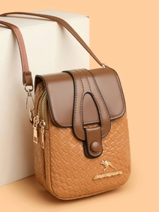 Detail of woven texture and golden kangaroo logo on brown crossbody phone bag
