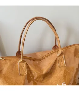 Detail of Tyvek tote bag with waterproof PVC layer and reinforced X-stitch handles