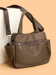 Coffee brown nylon crossbody bag with multi-layer capacity and adjustable shoulder strap