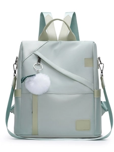 Mint green waterproof Oxford cloth backpack for women with plush ball charm and strap detail