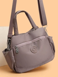 Durable nylon multi-layer crossbody handbag with adjustable strap in deep purple finish