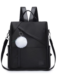 Large black Oxford cloth women's backpack with white pompom pendant and front zippers