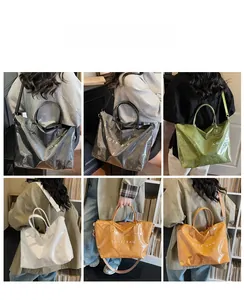 Detail of waterproof Dupont paper tote bag in various colors with adjustable canvas strap
