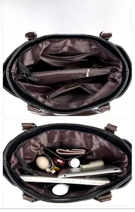 Vue macro de l'intérieur du sac en cuir noir avec plusieurs compartiments et doublure brune