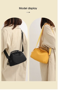 Model display of black and yellow waterproof oxford nylon shoulder bags with top handles