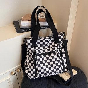 Black and white checkerboard corduroy tote bag with multiple pockets for daily commute