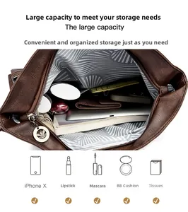Detail view of large interior capacity and striped lining of a dark brown leather tote bag