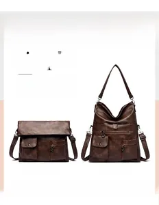 Detail view of the vintage brown tote bag showing versatile folding shapes and dual straps