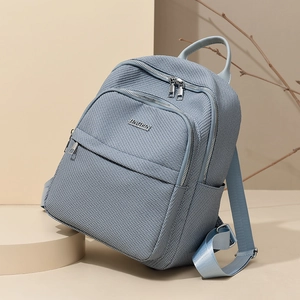 Sac à dos femme en nylon tissé bleu-gris avec grande capacité et fermetures métalliques