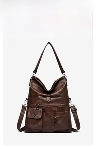 Detailed view of dark brown vintage tote bag with multiple pockets and natural PU texture