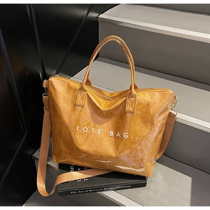 Detail of Tyvek tote bag with transparent PVC layer and adjustable shoulder strap