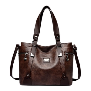 Large dark brown faux leather tote bag with top handles and adjustable shoulder strap