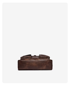 Detailed bottom view of vintage dark brown leather tote bag with precise stitching