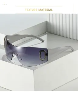 Close-up of silver oversized Y2K sunglasses with gradient purple lenses and metal accents
