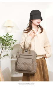 Close-up of quilted coffee nylon backpack with side pockets and metallic kangaroo logo