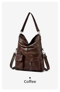 Close-up of coffee brown tote bag showing retro faux leather texture and bronze hardware