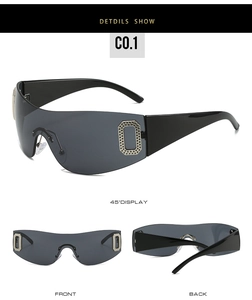 Detail view of Y2K style oversized black sunglasses with silver hollow metal side accents