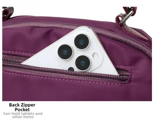 Close-up of purple oxford fabric bag featuring a secure back anti-theft zipper pocket