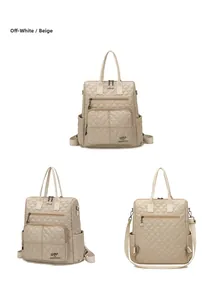 Detail view of the quilted rhombic texture and metal kangaroo logo on an off-white nylon bag