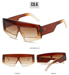 Detailed views of amber gradient oversized shield sunglasses with triple metal rivets