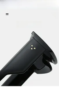 Detail of glossy black temples with golden rivets on oversized geometric sunglasses