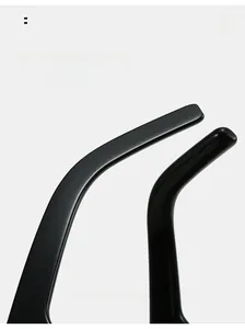 Detail of curved ergonomic temple arms on oversized black fashion sunglasses for comfort