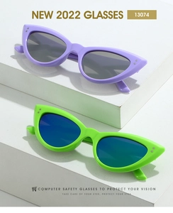 Close-up of cat-eye sunglasses featuring rice nail rivets and vibrant frames