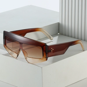 Fashionable oversized brown gradient shield sunglasses with metal rivet side accents