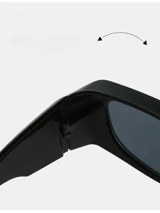 Detail of durable matte black textured hinge on modern Y2K wraparound sunglasses