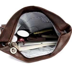 Retro brown large capacity tote bag showing spacious interior with tablet and books