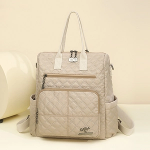 Beige quilted nylon backpack for women with spacious capacity and lightweight casual design