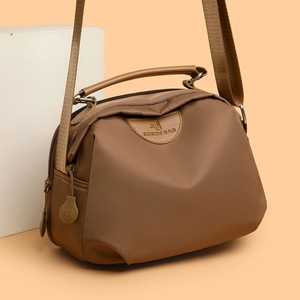 Brown high-capacity nylon crossbody bag for women with wide shoulder strap and handle