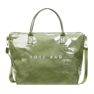 Modern grass green Tyvek tote bag with glossy finish and adjustable shoulder strap