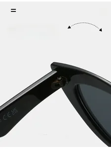 Detail view of the durable metal hinge on black cat-eye sunglasses with CE certification