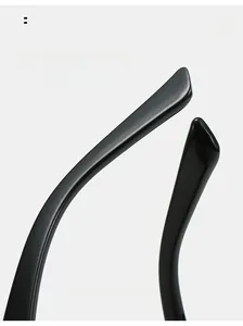 Detail of curved black glossy temple tips on cat eye sunglasses for ergonomic comfort