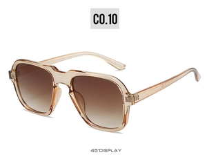 Detail view of champagne geometric sunglasses at 45-degree angle with brown gradient lenses