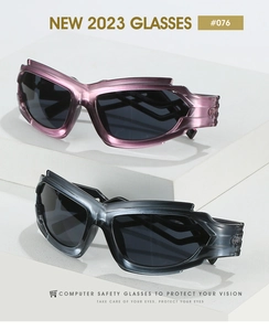 Detail of Y2K punk sports sunglasses with translucent purple and gray frames on display