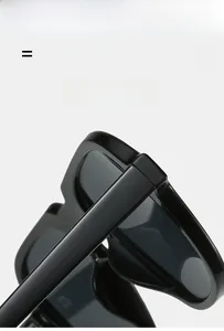 Detail of lightweight black geometric sunglasses with super elastic frame and hinges