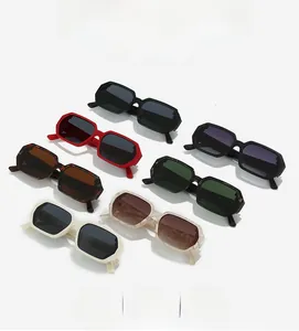 Flat lay array of retro polygon sunglasses in multiple vibrant colors and thick frames