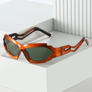 Y2K punk style sunglasses with amber translucent frames and wavy hollow temples