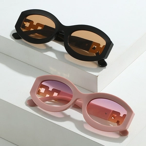 Chic oval sunglasses with hollow chain temples in black-orange and pink-purple colors