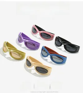Flat lay of retro Y2K oval sunglasses in multiple vibrant colors on white background