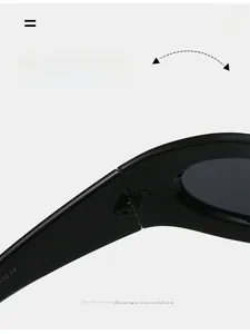 Close-up of durable metal hinges on oversized Y2K sunglasses with black glossy frames
