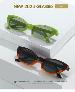 Close-up of retro cat-eye computer safety glasses in green and black frames