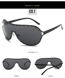 Detail view of large black shield sunglasses with silver stud frame and wrap design