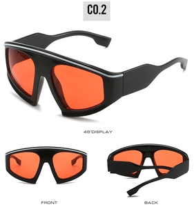 Three-view display of black cycling glasses with orange lenses and silver top accents